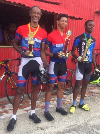 Winners of the men’s road race from Woodbridge Bay to Bellevue Chopin (Hill Challenge), April 7, 2019. From L-R, Levi Baron third place, Khoath Baron 1st place, Kevon Boyd second place.