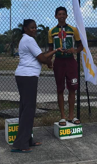 Dominica Cycling Association member, Kohath Baron accepts the second place trophy after participating in the 2018 Subway 3-Stage Invitational cycling competition, Aug. 25, 2018 in Antigua.