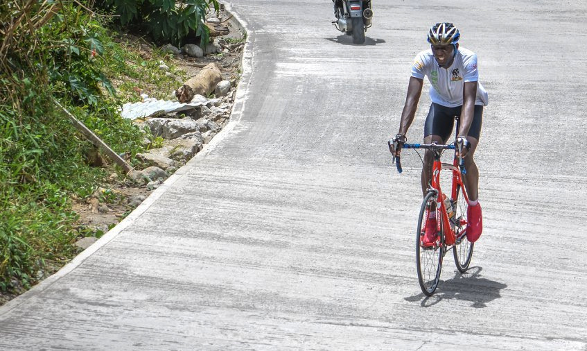 A Grenadian Cyclist competes in the 2018 Organization of Eastern Caribbean States Cycling Championship in Dominica, July 1, 2018. Six OECS countries participated in the nearly 60-mile long event hosted by the DCA.