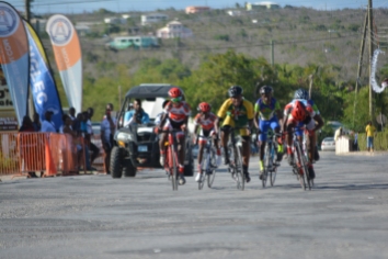 Ajaniah Casimir, (center) a member of the Dominica Cycling Association, participates in the 20th John T. Memorial Cycling Race, in Anguilla, July 21, 2019. Casimir finished first in the Benjamin category.