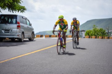 Hayden Mills, front, and Levi Baron, members of the Dominica Cycling Association, compete in the 2018 Organization of Eastern Caribbean States Cycling Championship in Dominica, July 1, 2018. Six OECS countries participated in the nearly 60-mile long event hosted by the DCA.